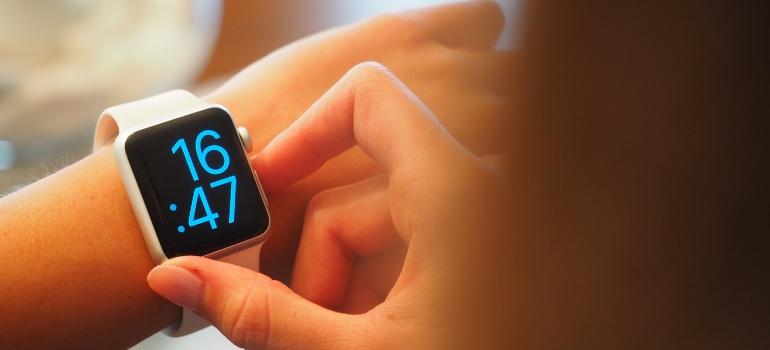 person looking at a wrist watch